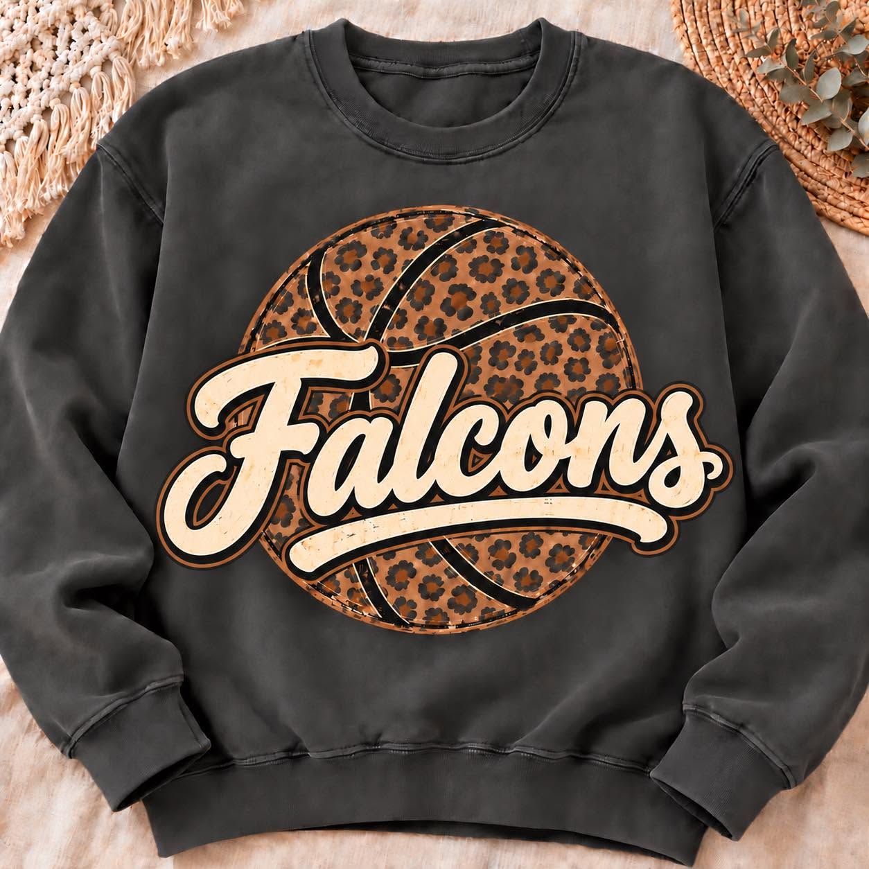 Falcons cream script over a leopard basketball on a dark gray sweatshirt