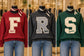 Falcons varsity F design shown at left in the group mockup