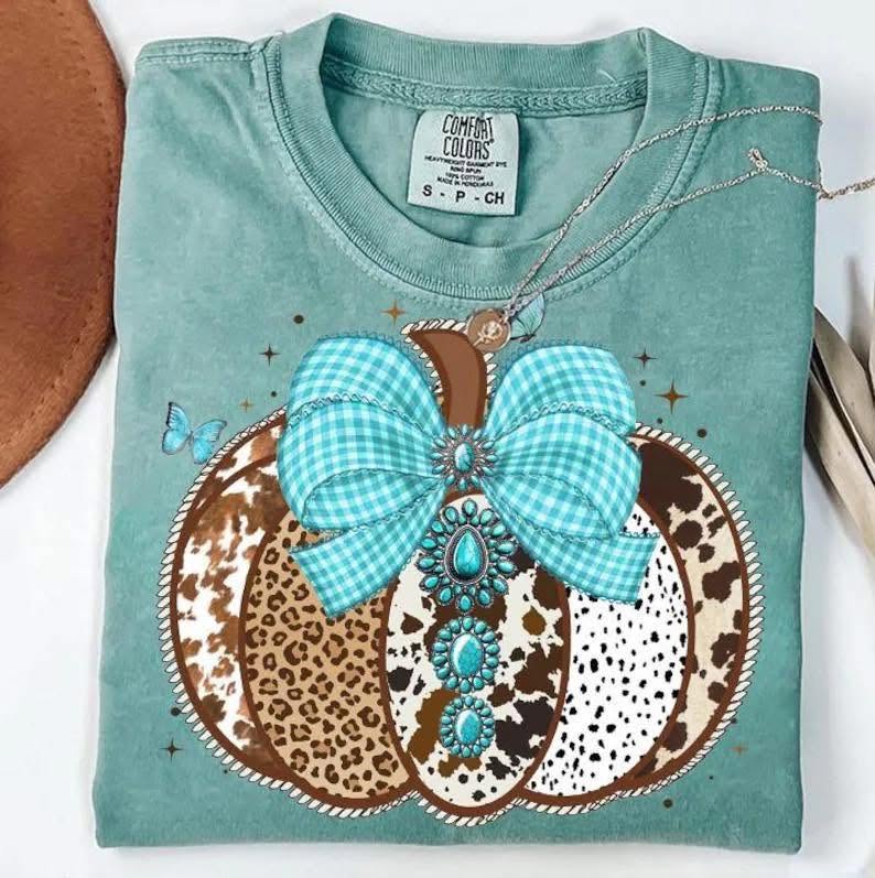 Western patchwork pumpkin with turquoise gingham bow on teal shirt