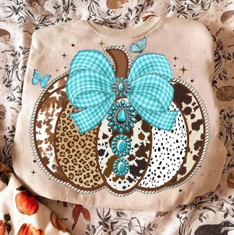 Western patchwork pumpkin with turquoise bow on cream sweatshirt