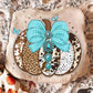 Western patchwork pumpkin with turquoise bow on cream sweatshirt